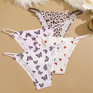 Macro view of seamless women's low-waist panties with leopard and butterfly prints.