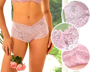 Close-up detail of women's sheer pink lace panties featuring delicate floral embroidery