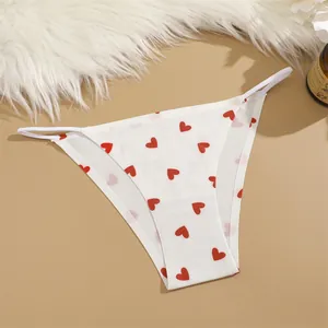 Detail view of white seamless low waist panties featuring a cute red heart print.