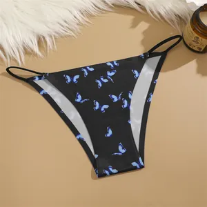 Close-up view of women's low-waist ice silk panties with a vibrant blue butterfly print
