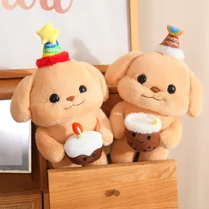 Two cute plush puppy dogs in a wooden drawer wearing party hats and holding a cake.