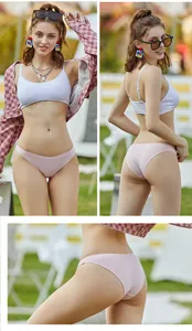 Close-up detail of soft pink cotton panties showing comfortable V-waist and fit