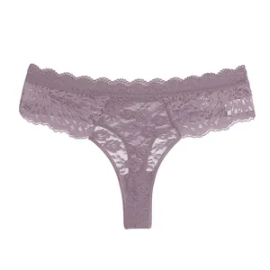 Close up view of women lace thong, semi transparent floral pattern, mid waist design.