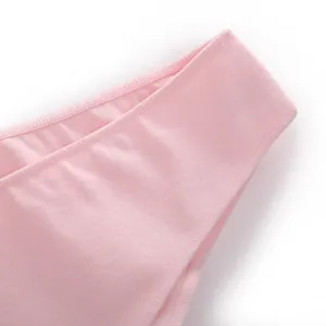 Macro detail of pink cotton panties showing soft breathable fabric and fine stitching.
