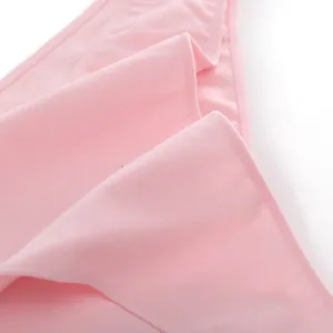 Macro close-up detail showing the soft pink cotton fabric texture and stitching on women's briefs.