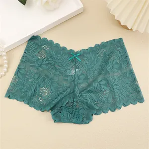 Detailed view of soft dark teal translucent lace panties featuring a delicate satin bow