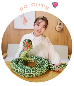 Realistic green python plush toy snake held by a model for home decor or fun prank