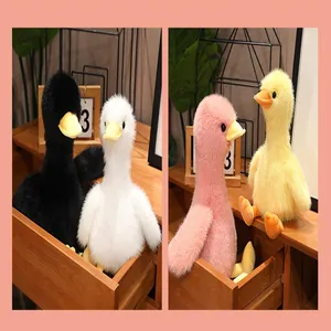 Detailed view of plush duck toys in multiple pastel colors with soft faux mink fur.