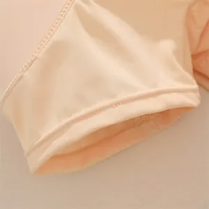 Macro detail showing precise stitching and soft fabric of seamless hip enhancer underwear.
