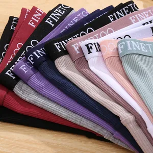 Detail shot of multi-colored ribbed cotton panties showing elastic lettered waistbands