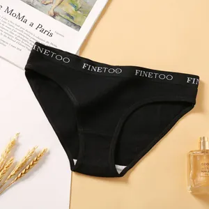 Detail view of black ribbed cotton women's bikini panties with logo waistband