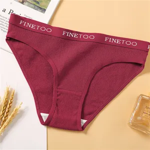 Detail of ribbed cotton women briefs in burgundy red with branded elastic waistband