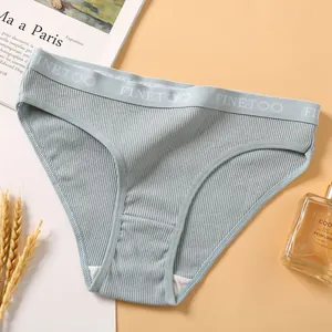 Close-up of light blue ribbed cotton bikini panties showing elastic waistband detail.