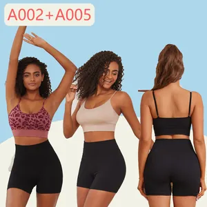 Three models presenting women's two-piece yoga set with sports bra and high-waisted shorts