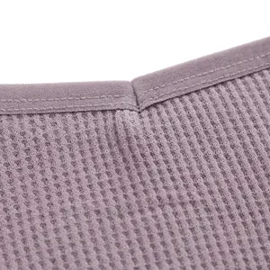 Dettaglio macro di alta qualità del tessuto in cotone nido d'ape traspirante per biancheria