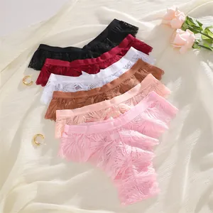 Close-up detail of assorted lace thongs featuring elegant frills and small bow accents