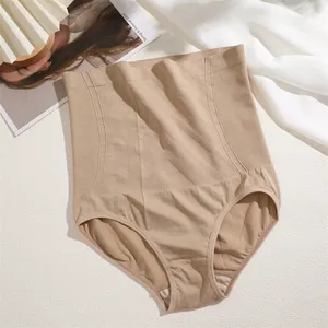 Detailed view of high-waist seamless tummy control shapewear in nude beige tone