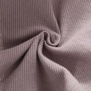 Detailed macro view showing the soft ribbed cotton texture of the mauve bikini panties