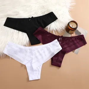 Detailed close-up view of sheer mesh panties in black, burgundy, and white with bows