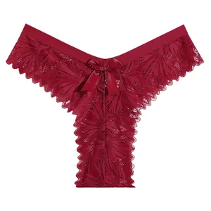Burgundy lace thong for women with bow detail and floral pattern on white background