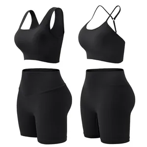 Women's black ribbed yoga set featuring tummy control shorts and push-up sports bra