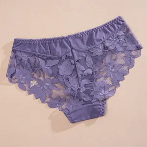 Close-up showing the intricate floral lace fabric on these purple low-rise panties.