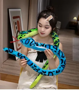 Realistic colorful plush snakes held by a model, perfect for prank or gift decoration