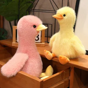 Pair of cute plush duck toys in pink and yellow macaron colors made of soft mink fur