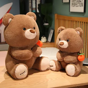 Detailed view of two brown teddy bear plush toys with small persimmon accessories.