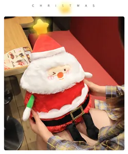 Close-up of a festive plush Santa Claus doll featuring a glowing yellow star topper.