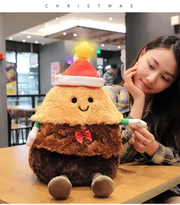Close-up of a festive singing gingerbread man plush toy with a glowing Christmas hat gift