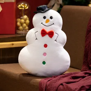Coussin décoratif bonhomme de neige en peluche avec nœud papillon rouge pour Noël