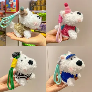 Set of four plush West Highland Terrier dog keychains with colorful clothes and lanyards