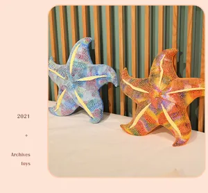 Soft and colorful starfish plush pillows resting on a bed with a wooden headboard