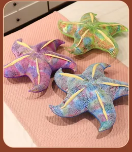Detailed view of colorful iridescent starfish plush pillows in purple, green, and blue