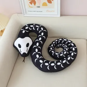 Detailed view of black plush snake toy with white crescent patterns and skull head