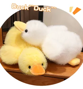 Macro view showing the soft texture of white and yellow fluffy plush duck toy dolls