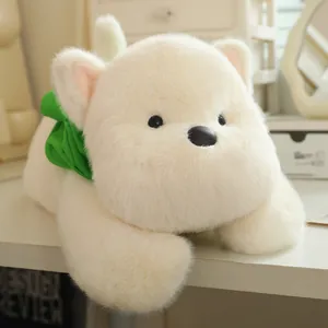 Detailed view of a soft fluffy white West Highland Terrier plush toy with a green bow tie