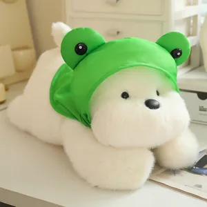 Cute plush Westie dog toy wearing a bright green frog hood, soft lying stuffed animal toy.