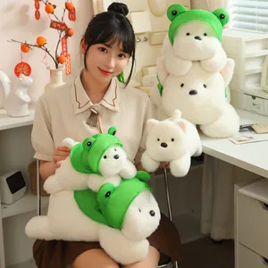 Asian model holding several sizes of cute Westie plushies wearing frog hats