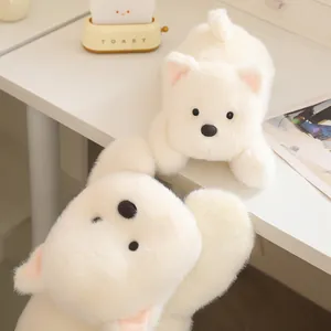Macro detail of soft fluffy white West Highland Terrier plush toy lying on a white desk