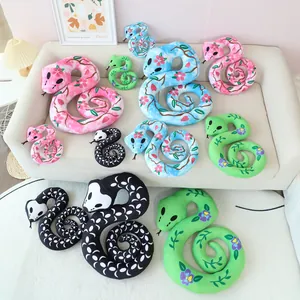 Collection of colorful floral and skull pattern snake plush toys for Halloween decor