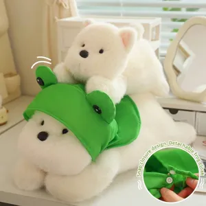 Detailed macro shot of the plush Westie dog toy wearing a removable green frog hooded cape.