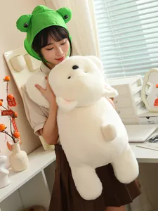 Girl holding a large white Westie puppy plush toy with soft fluffy fur texture.