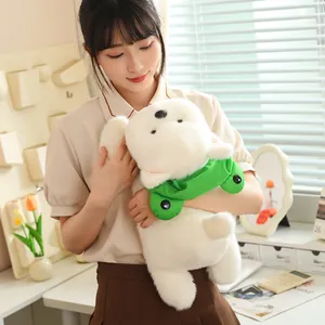 Detailed view of a soft white Westie plush puppy dog doll being held by a young woman