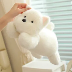 Detailed macro view showing the ultra-soft white faux fur texture of a Westie plush toy