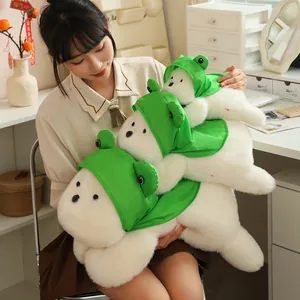 Cute West Highland Terrier plush toy wearing a green frog hood, detail showing three sizes.