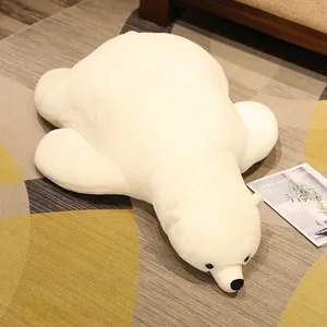 Large soft polar bear plush toy lying flat on floor as a comfortable sleeping pillow