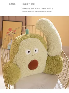 Cozy avocado-shaped plush backrest pillow with a cute face on a modern gold chair for office