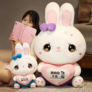 Two sweet rabbit plush toy pillows shown with an Asian model in a cozy home setting